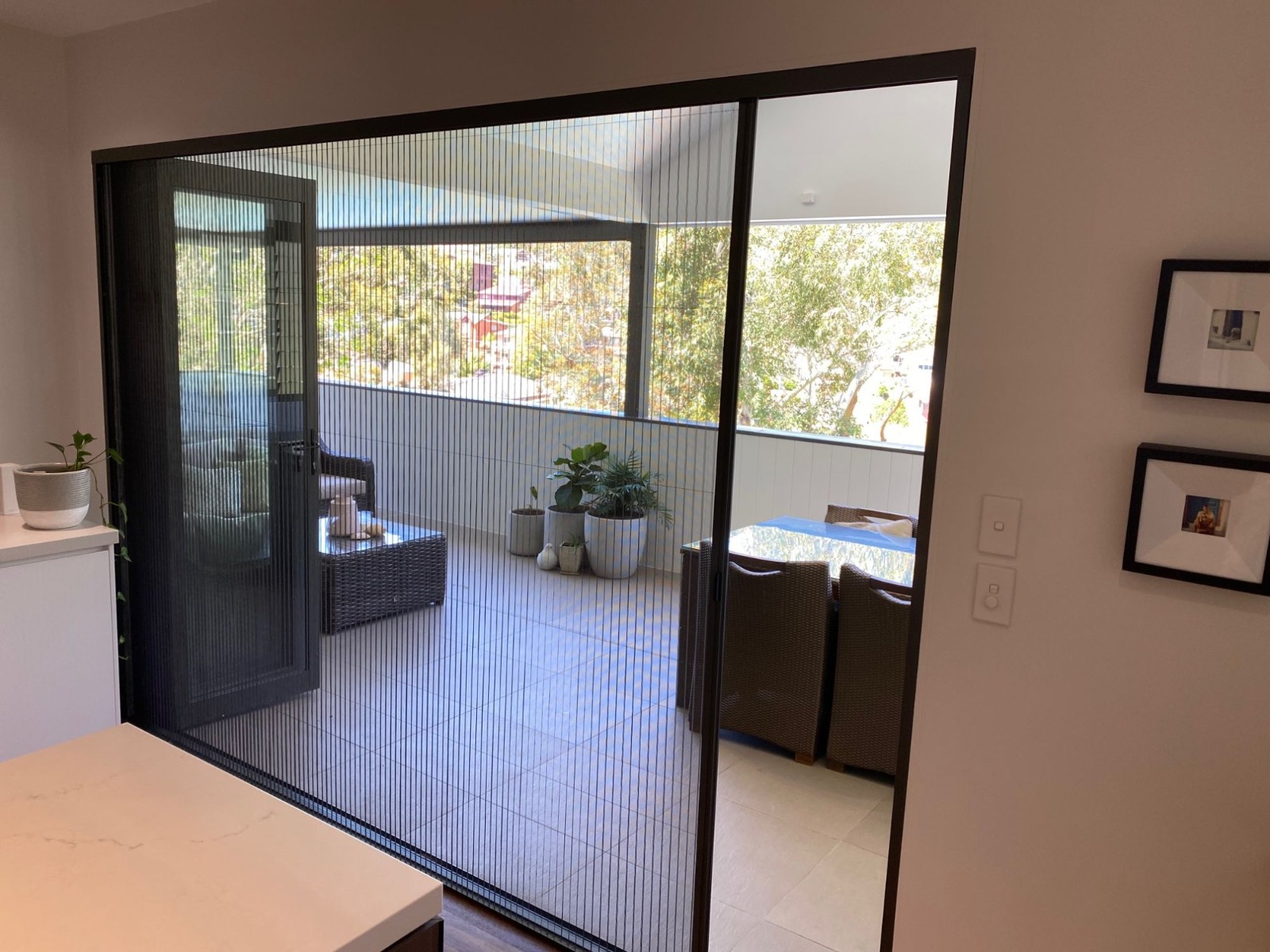 Blinds fitted across a large outdoor-facing doorway